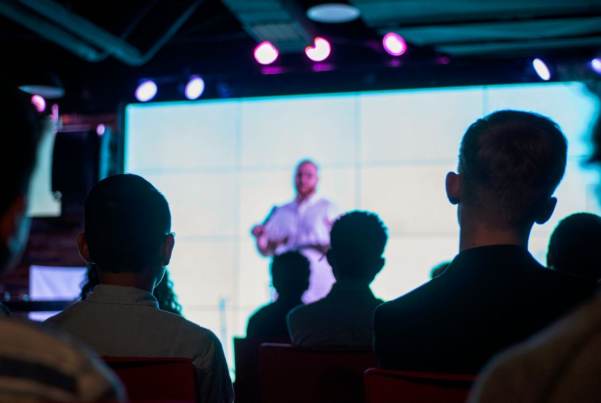 Event planners working with a speakers bureau to select the perfect keynote speaker for their event